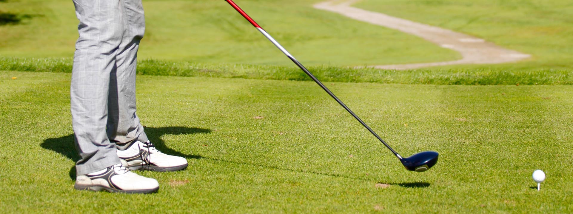 Golf - Person som håller i golfklubba